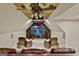 Media room with large mounted TV, custom lighting, leather seating and a unique ceiling design at 113 Regents Sq, Peachtree City, GA 30269