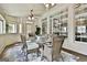 Bright sunroom with hardwood floors, multiple windows, ceiling fan and wicker dining set at 113 Regents Sq, Peachtree City, GA 30269