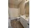 Bathroom features a tub and shower combination and white vanity at 1110 Saint Phillips Ct, Locust Grove, GA 30248