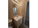 Bathroom featuring a standard vanity, mirror, toilet and tile flooring at 1110 Saint Phillips Ct, Locust Grove, GA 30248