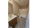 Bathroom features a tub and shower combination and vanity with sink at 1110 Saint Phillips Ct, Locust Grove, GA 30248