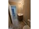 Bathroom features a vanity with a sink and a toilet with tile flooring at 1110 Saint Phillips Ct, Locust Grove, GA 30248