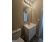 Bathroom features a vanity with a sink and toilet at 1110 Saint Phillips Ct, Locust Grove, GA 30248
