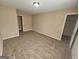Spacious bedroom featuring neutral paint, carpet, and ample natural light at 1110 Saint Phillips Ct, Locust Grove, GA 30248