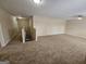 Spacious bonus room featuring neutral carpet and multiple entryways at 1110 Saint Phillips Ct, Locust Grove, GA 30248