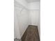 Walk-in closet with ample shelving and carpeted flooring at 1110 Saint Phillips Ct, Locust Grove, GA 30248