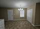 Well lit dining area featuring a door, window with blinds, and spacious closet with bi-fold doors at 1110 Saint Phillips Ct, Locust Grove, GA 30248