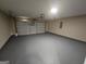 Spacious garage with epoxy flooring and ample room for storage at 1110 Saint Phillips Ct, Locust Grove, GA 30248