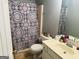 Bathroom featuring a shower/tub combo, single sink and neutral paint at 789 Winbrook Dr # 1, Mcdonough, GA 30253
