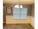 Bright dining room with natural light, chair rail, and traditional chandelier at 789 Winbrook Dr # 1, Mcdonough, GA 30253