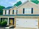 Charming two-story home with brick and vinyl siding, complemented by a well-maintained front yard at 789 Winbrook Dr # 1, Mcdonough, GA 30253