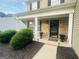 Inviting front porch with brick facade, decorative columns, and manicured landscaping at 789 Winbrook Dr # 1, Mcdonough, GA 30253