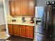 Kitchen featuring stainless steel appliances, wood cabinets, and granite countertops at 789 Winbrook Dr # 1, Mcdonough, GA 30253