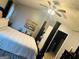 Main bedroom with dark furniture, neutral color palette, and ceiling fan at 789 Winbrook Dr # 1, Mcdonough, GA 30253