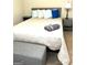 Bedroom with a queen-size bed, a neutral color scheme, and a bench at the end of the bed at 30 Highlands Ln, Oxford, GA 30054