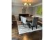 Modern dining room with a sleek table, elegant chandelier, and contemporary decor at 30 Highlands Ln, Oxford, GA 30054