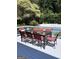 Elegant patio dining area with a large table and comfortable chairs for outdoor meals at 30 Highlands Ln, Oxford, GA 30054