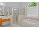 Bathroom with a soaking tub, step-in shower and great natural light at 1500 Royce Dr, Locust Grove, GA 30248