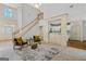Elegant living area showcasing an open layout and a stunning staircase at 1500 Royce Dr, Locust Grove, GA 30248