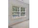 Large window brings in natural light and offers views of the trees and a road outside at 1500 Royce Dr, Locust Grove, GA 30248