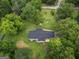 An aerial view of a beautifully landscaped property with lush greenery and mature trees at 3290 Ebenezer Se Rd, Conyers, GA 30094