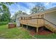 Exterior view of home with deck featuring wood railings and stairs at 3290 Ebenezer Se Rd, Conyers, GA 30094