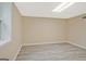 The finished basement space features new plank flooring and freshly painted walls at 3290 Ebenezer Se Rd, Conyers, GA 30094