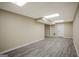Finished basement with hardwood-style floors and recessed lighting at 3290 Ebenezer Se Rd, Conyers, GA 30094