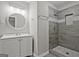 Updated bathroom features a stylish vanity, modern lighting, and a tiled walk-in shower for a spa-like experience at 3290 Ebenezer Se Rd, Conyers, GA 30094