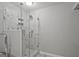 Modern bathroom featuring a walk-in shower with marble tiling and glass enclosure at 3290 Ebenezer Se Rd, Conyers, GA 30094