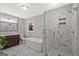 Elegant bathroom featuring double sinks, a soaking tub, and a glass-enclosed shower for a luxurious experience at 3290 Ebenezer Se Rd, Conyers, GA 30094