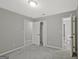 Spacious bedroom with neutral carpet, ample closet space, and multiple entryways, offering versatility and comfort at 3290 Ebenezer Se Rd, Conyers, GA 30094
