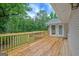 Expansive wooden deck for outdoor enjoyment and entertainment with lovely wooded views at 3290 Ebenezer Se Rd, Conyers, GA 30094