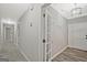 Inviting hallway featuring modern lighting, neutral paint, and stylish flooring for a bright and welcoming entrance at 3290 Ebenezer Se Rd, Conyers, GA 30094