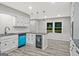 Updated kitchen featuring granite countertops, stainless steel appliances, subway tile backsplash, and gray wood floors at 3290 Ebenezer Se Rd, Conyers, GA 30094