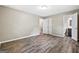 Spacious bedroom with laminate flooring, with a view to the attached bathroom at 5724 Amalfi Way, Douglasville, GA 30135