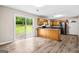 Open kitchen with wood cabinets and sliding doors to a spacious backyard at 5724 Amalfi Way, Douglasville, GA 30135