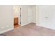 Carpeted bedroom featuring double closets with adjoining bathroom at 12323 Styron Dr, Hampton, GA 30228