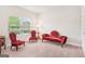 Cozy bedroom featuring plush carpet, a large window, and elegant antique furniture at 12323 Styron Dr, Hampton, GA 30228