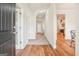 Bright entryway with hardwood floors leads to spacious rooms, showcasing an open layout at 12323 Styron Dr, Hampton, GA 30228