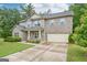 Attractive two-story brick house with a well-kept lawn and an attached two-car garage at 12323 Styron Dr, Hampton, GA 30228
