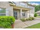 Welcoming front porch with brick columns and manicured landscaping enhancing the home's curb appeal at 12323 Styron Dr, Hampton, GA 30228