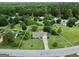 Aerial view of property with a manicured lawn, mature trees and a storage shed at 130 Belmont Trl, Covington, GA 30016