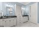 Bathroom featuring dual sinks, granite countertops, and ample storage space in custom cabinetry at 157 Waterlace Way, Fayetteville, GA 30215