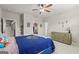 Bedroom with a ceiling fan, plantation shutters, and playful decor at 157 Waterlace Way, Fayetteville, GA 30215