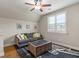 Bonus room with a plush couch, and a modern coffee table at 157 Waterlace Way, Fayetteville, GA 30215