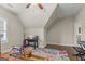 Bonus room with hardwood floors and a brightly colored rug at 157 Waterlace Way, Fayetteville, GA 30215