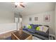 Bonus room with hardwood floors, couch, and natural lighting at 157 Waterlace Way, Fayetteville, GA 30215
