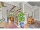 A cozy foyer featuring hardwood floors, an elegant staircase, and a decorative plant at 157 Waterlace Way, Fayetteville, GA 30215