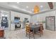 Eat in kitchen with white cabinets, stainless steel appliances, and tile backsplash at 157 Waterlace Way, Fayetteville, GA 30215